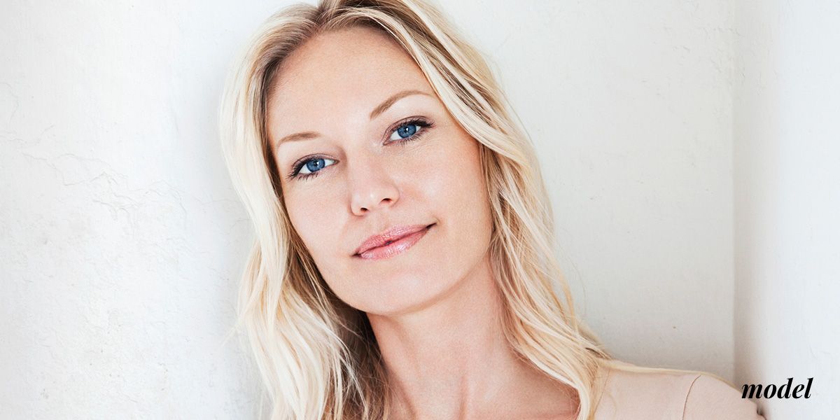 Portrait of a woman with long, blonde hair.