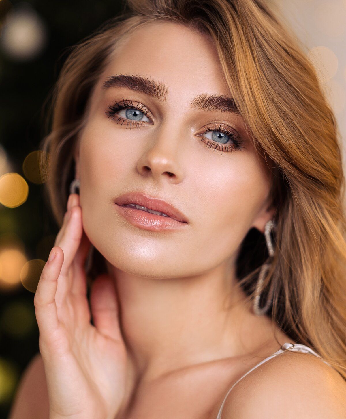 Close-up of woman with beautiful features and makeup.