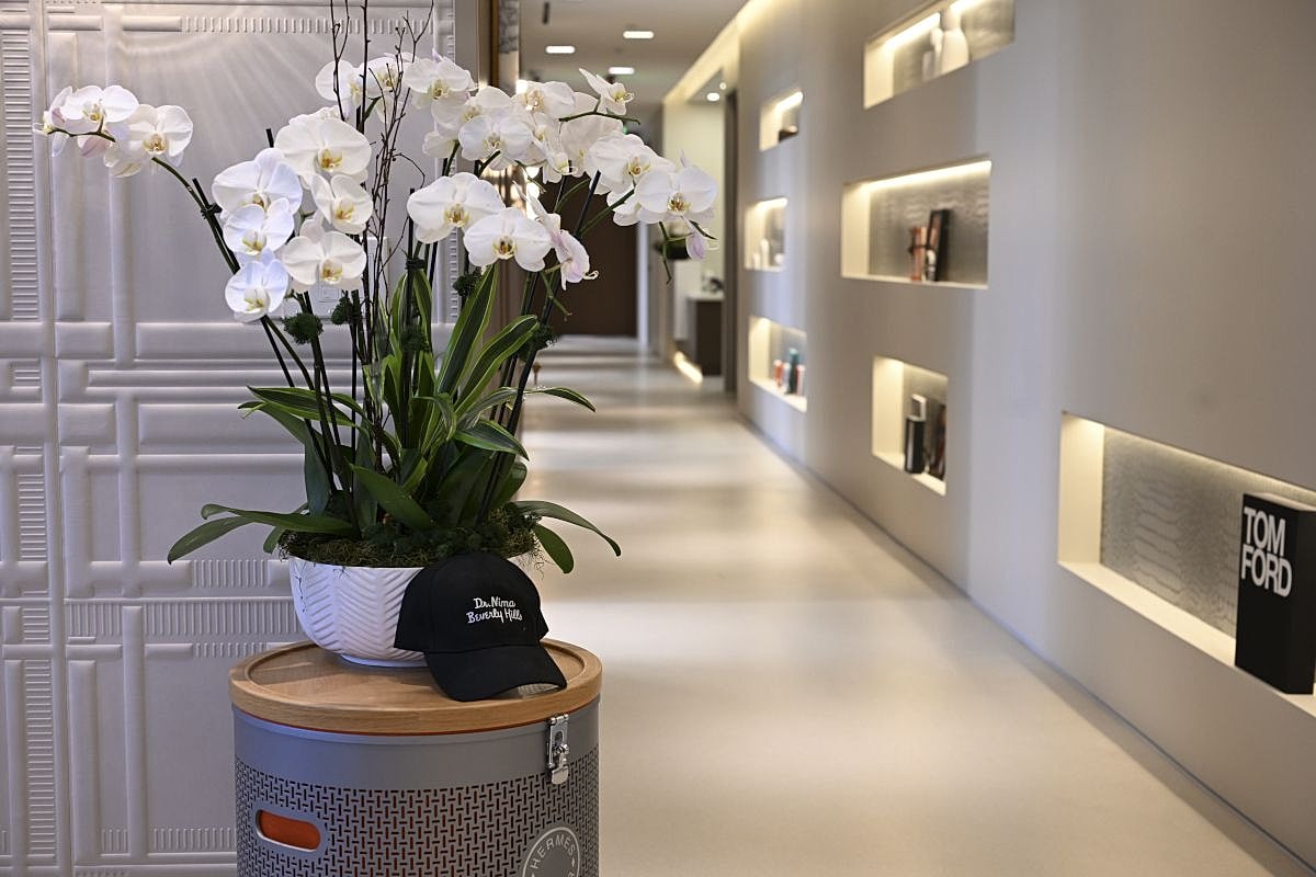 Flowers and hat in modern interior setting.