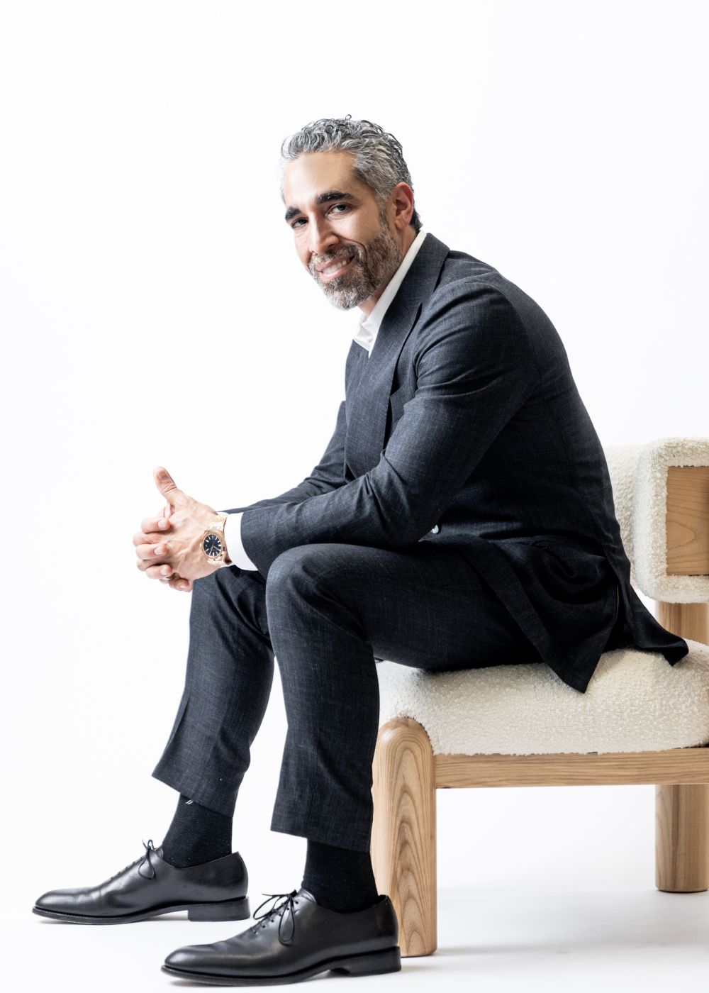 Dr. Nima Shemirani posing in chair