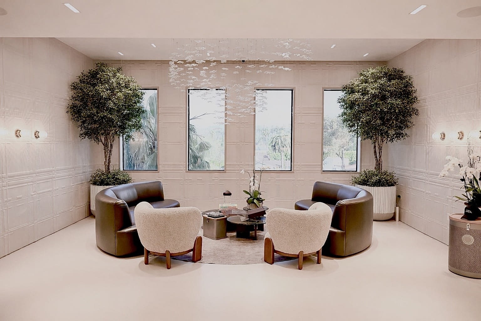 Modern seating area with plants and natural light.