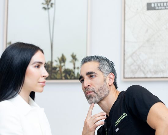 Dr. Nima Shemirani, Beverly Hills plastic surgeon with patient