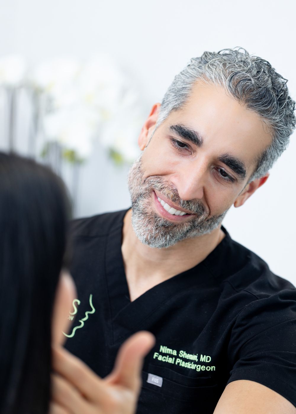 Dr. Nima Shemirani with a patient